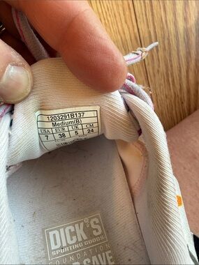 Brooks women's white sneakers with pink accents